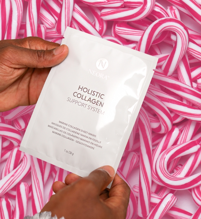 Pack of Collagen Sheet Masks on top of candy canes.